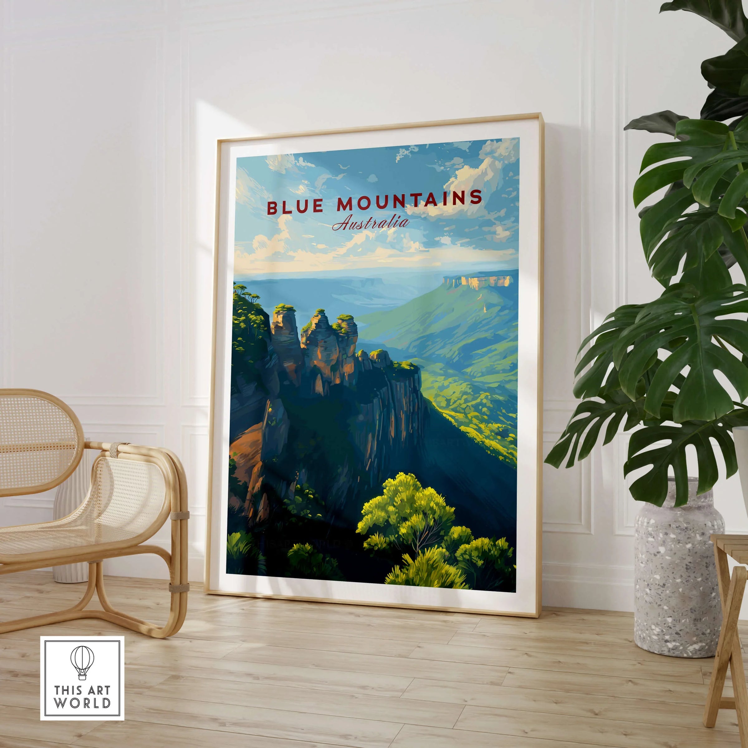 Blue Mountains Australia travel poster framed on the floor in a modern living room with a chair and plant