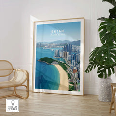 Framed Busan South Korea skyline wall art poster in modern living room with chair and plant