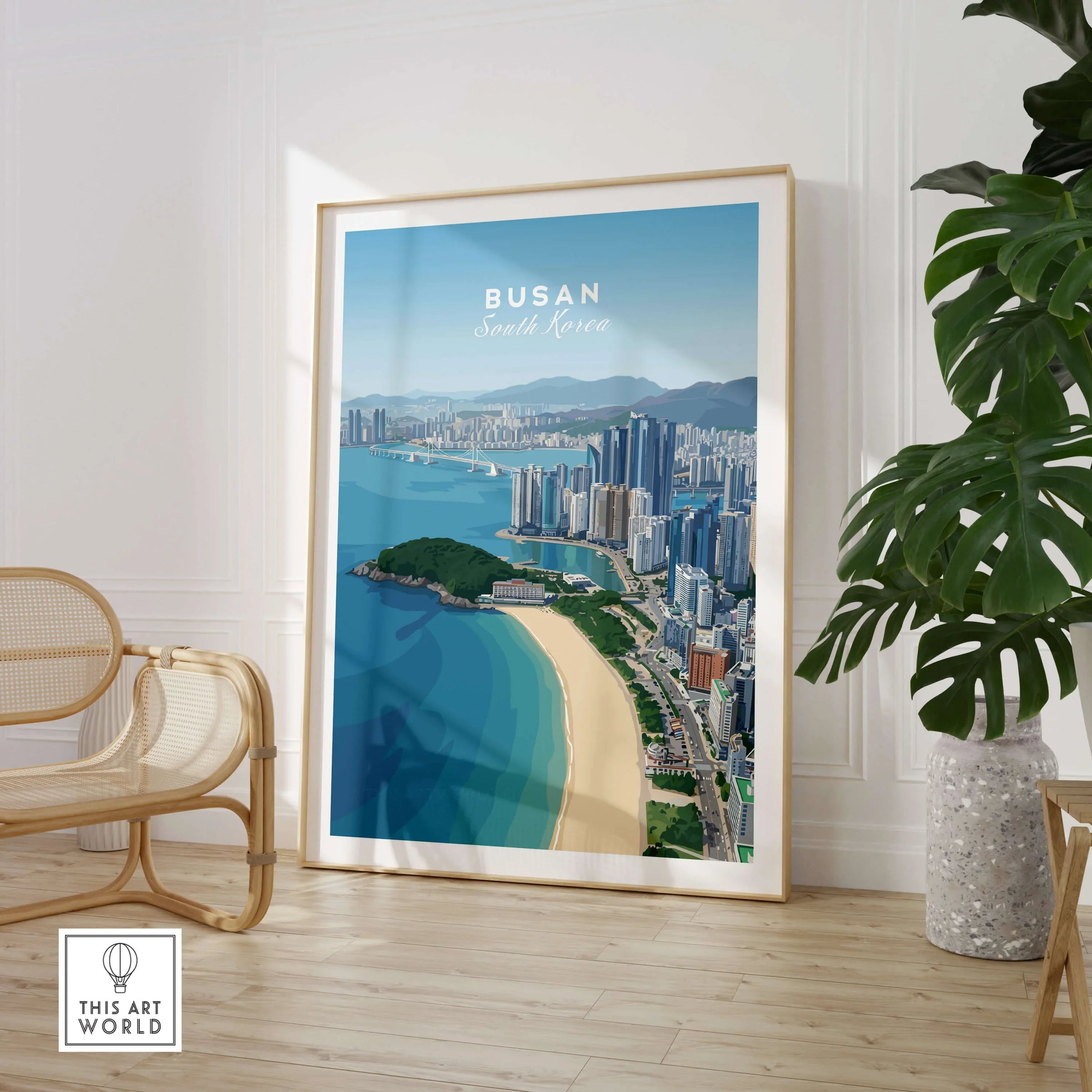 Framed Busan South Korea skyline wall art poster in modern living room with chair and plant