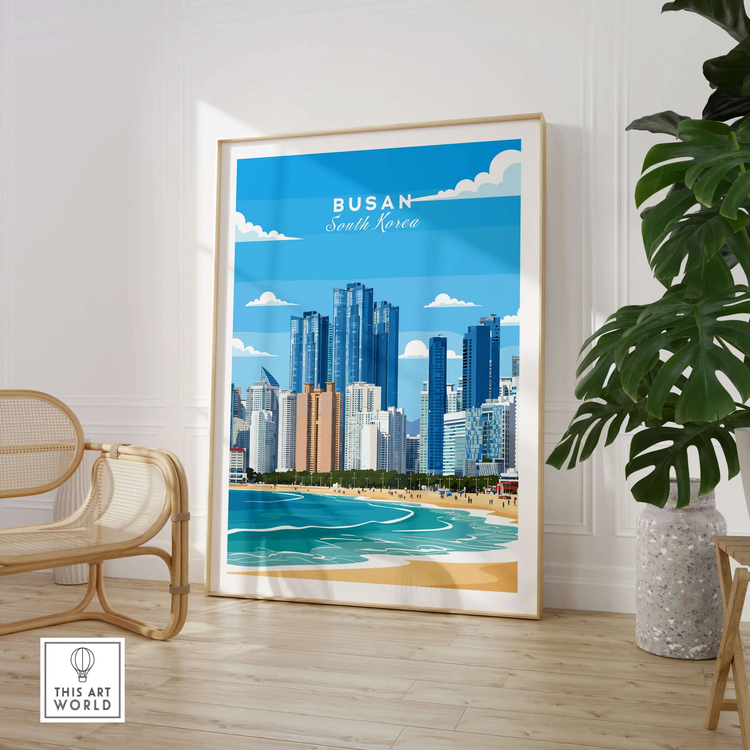 Busan South Korea travel poster framed art print in modern living room with chair and plant