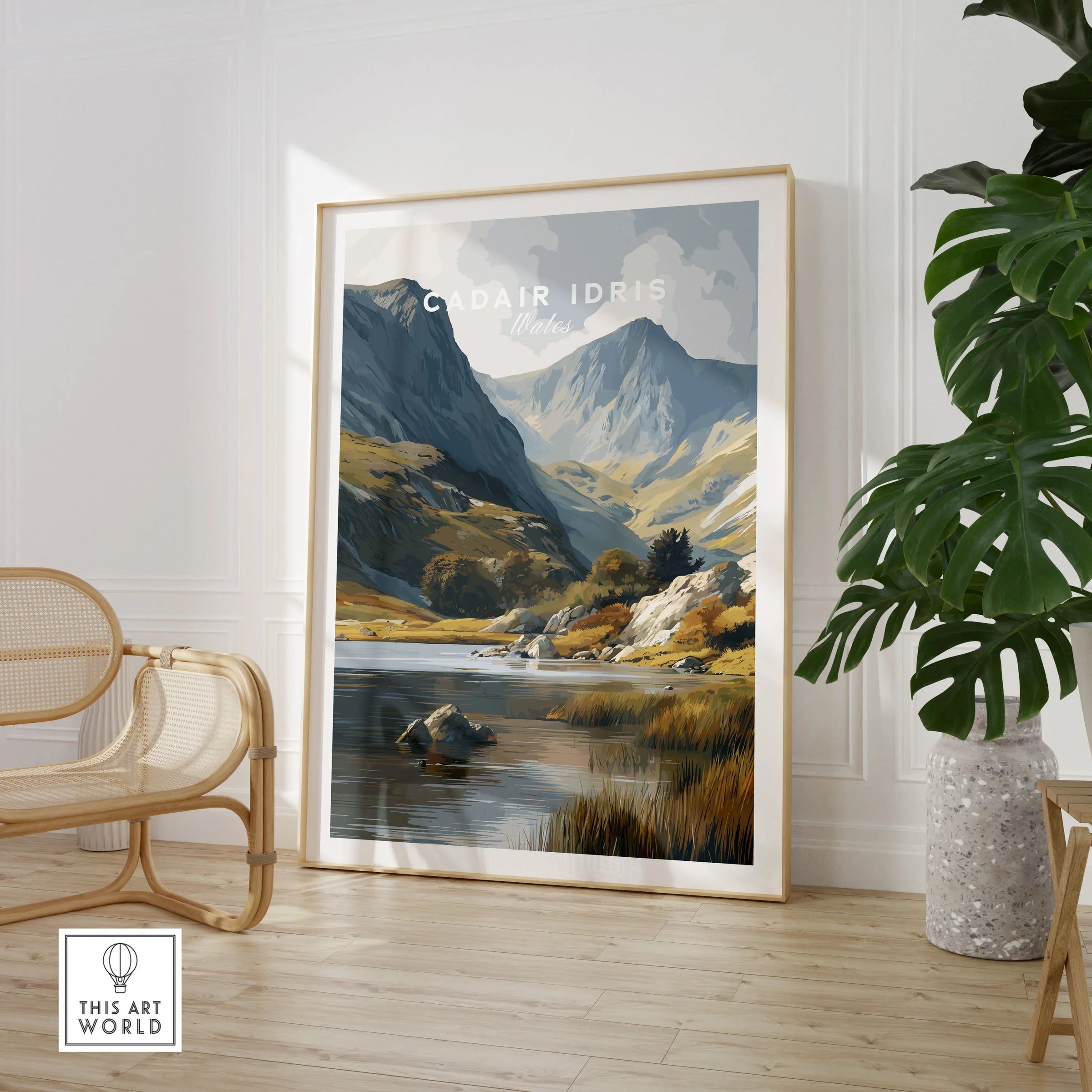 Framed Cadair Idris Wales travel poster print in modern living room with chair and plant