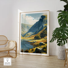 Framed Cadair Idris Wales travel poster in modern room with chair and houseplant