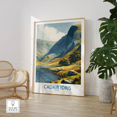 Framed Cadair Idris Wales travel poster in modern room with chair and houseplant
