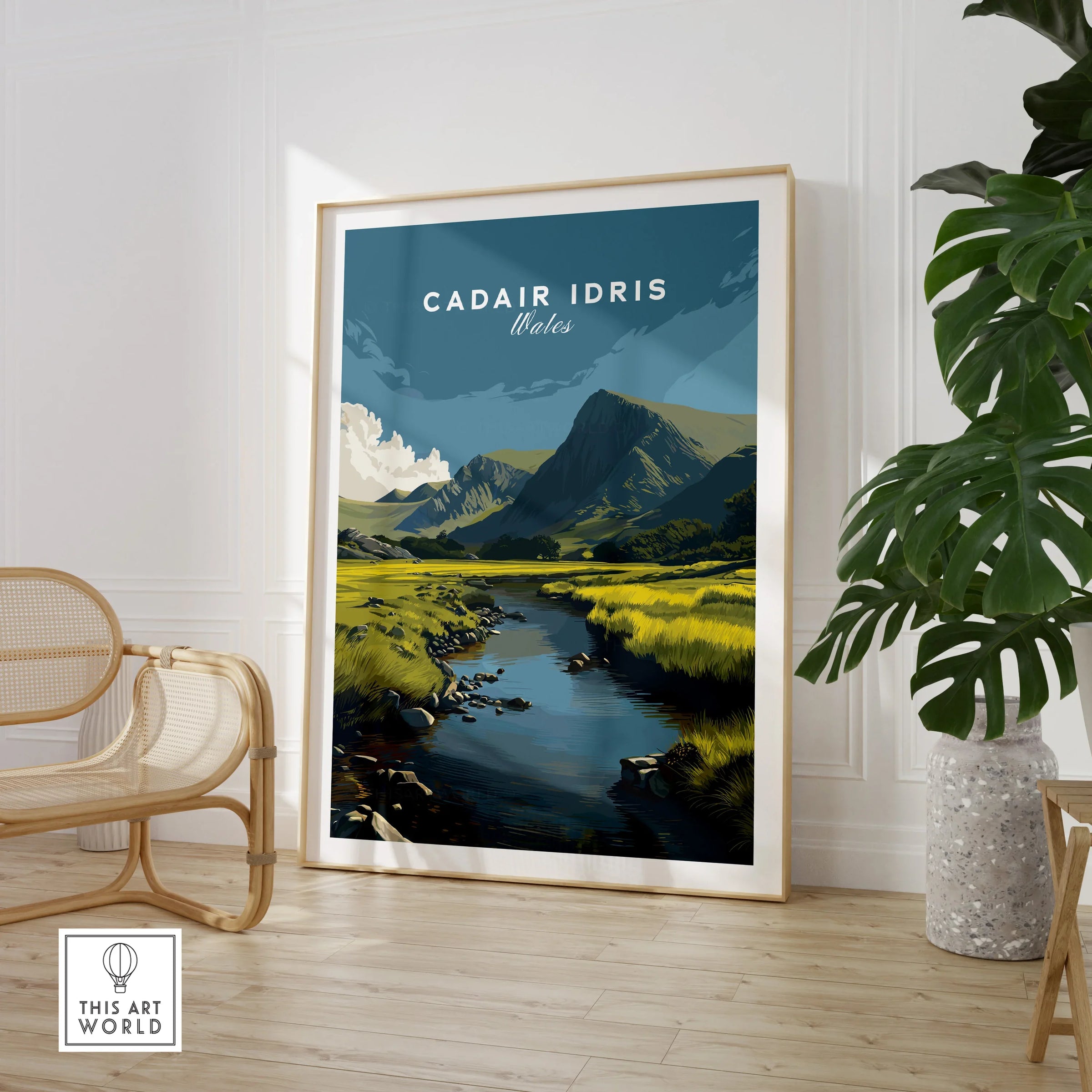 Cadair Idris Wales art print in modern room with rattan chair and leafy plant