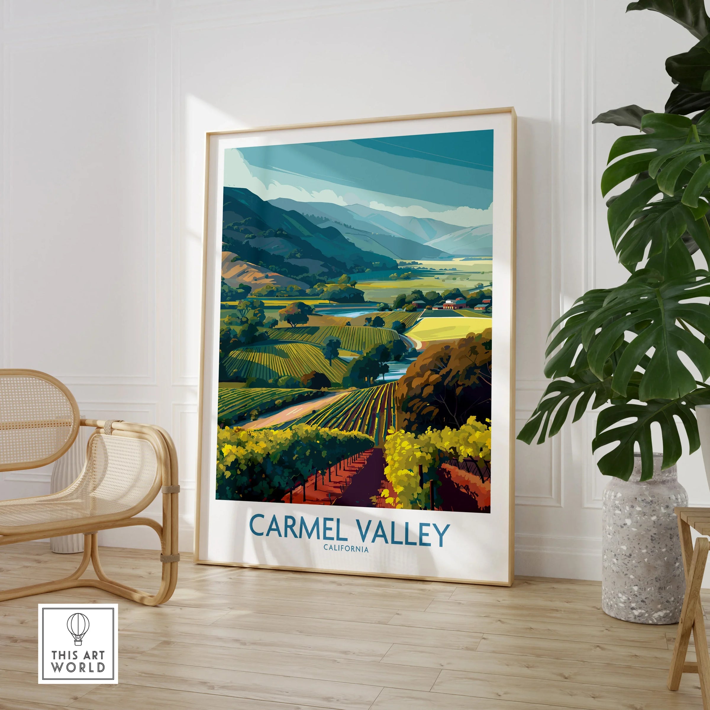 Carmel Valley California travel poster framed print in modern room with chair and plant