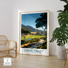 Framed Carmel Valley California travel poster in modern room with chair and houseplant