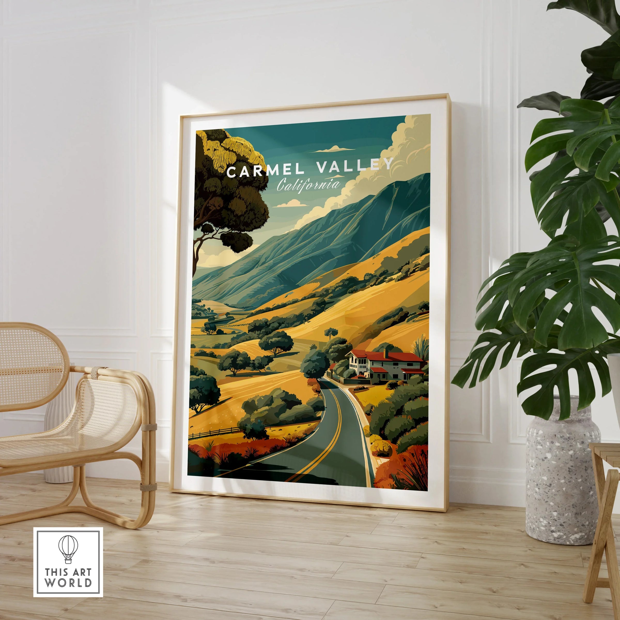 Framed Carmel Valley California travel poster in modern room with chair and plant