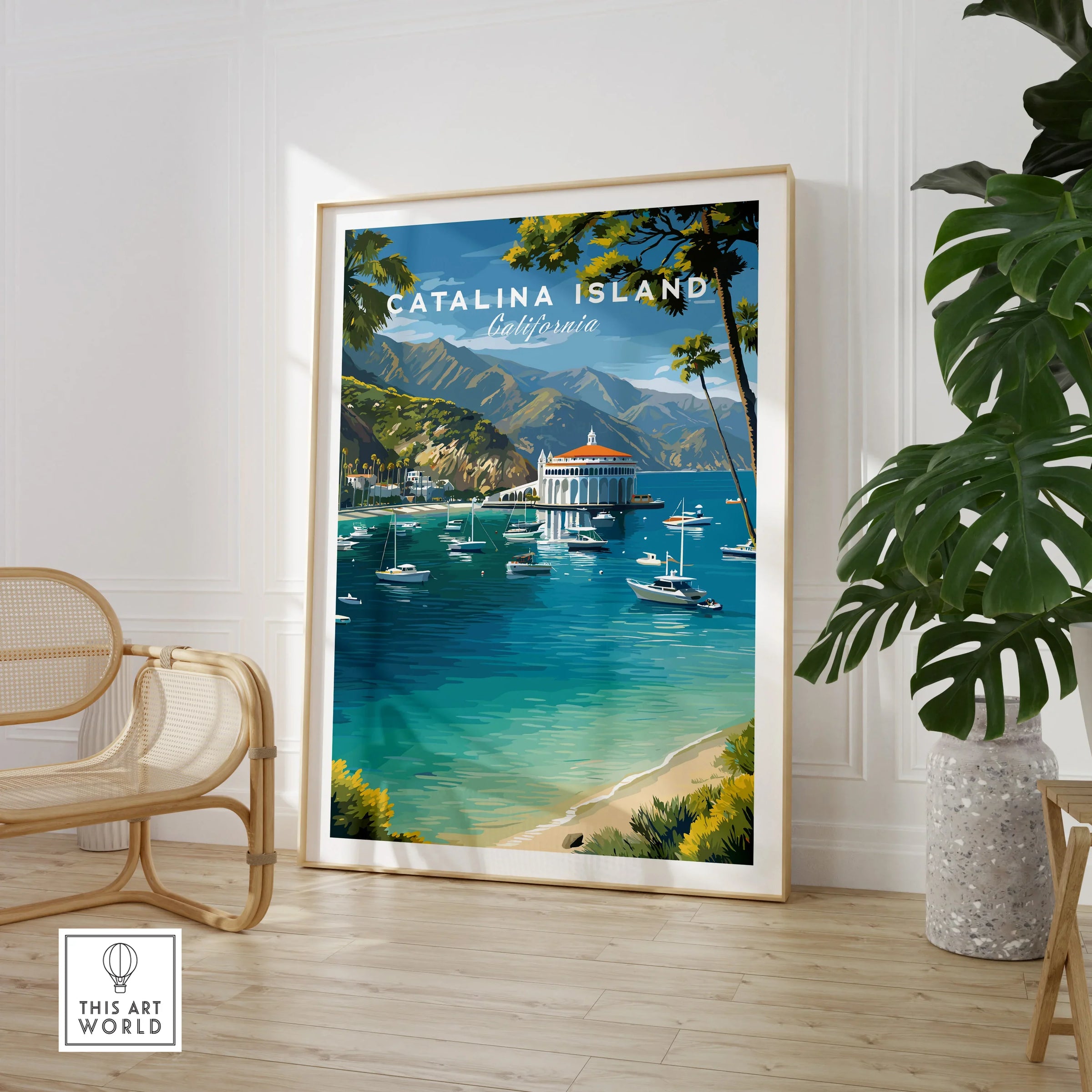 Framed Catalina Island travel poster print in modern room with chair and plant