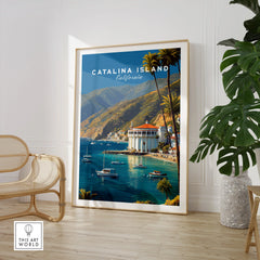 Framed Catalina Island travel poster with boats and coastline in a modern room with chair and plant