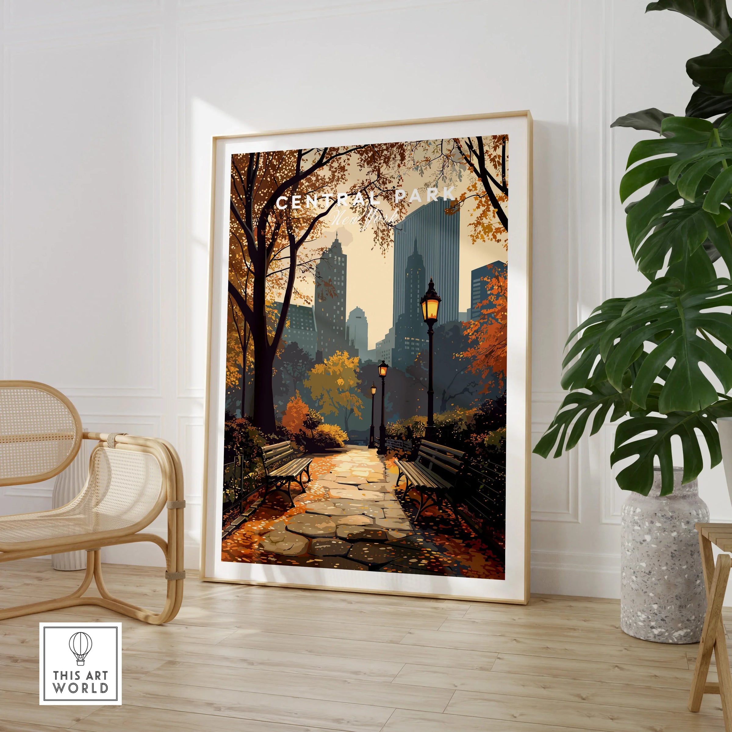 Framed Central Park art print with fall cityscape, styled in modern home decor setting