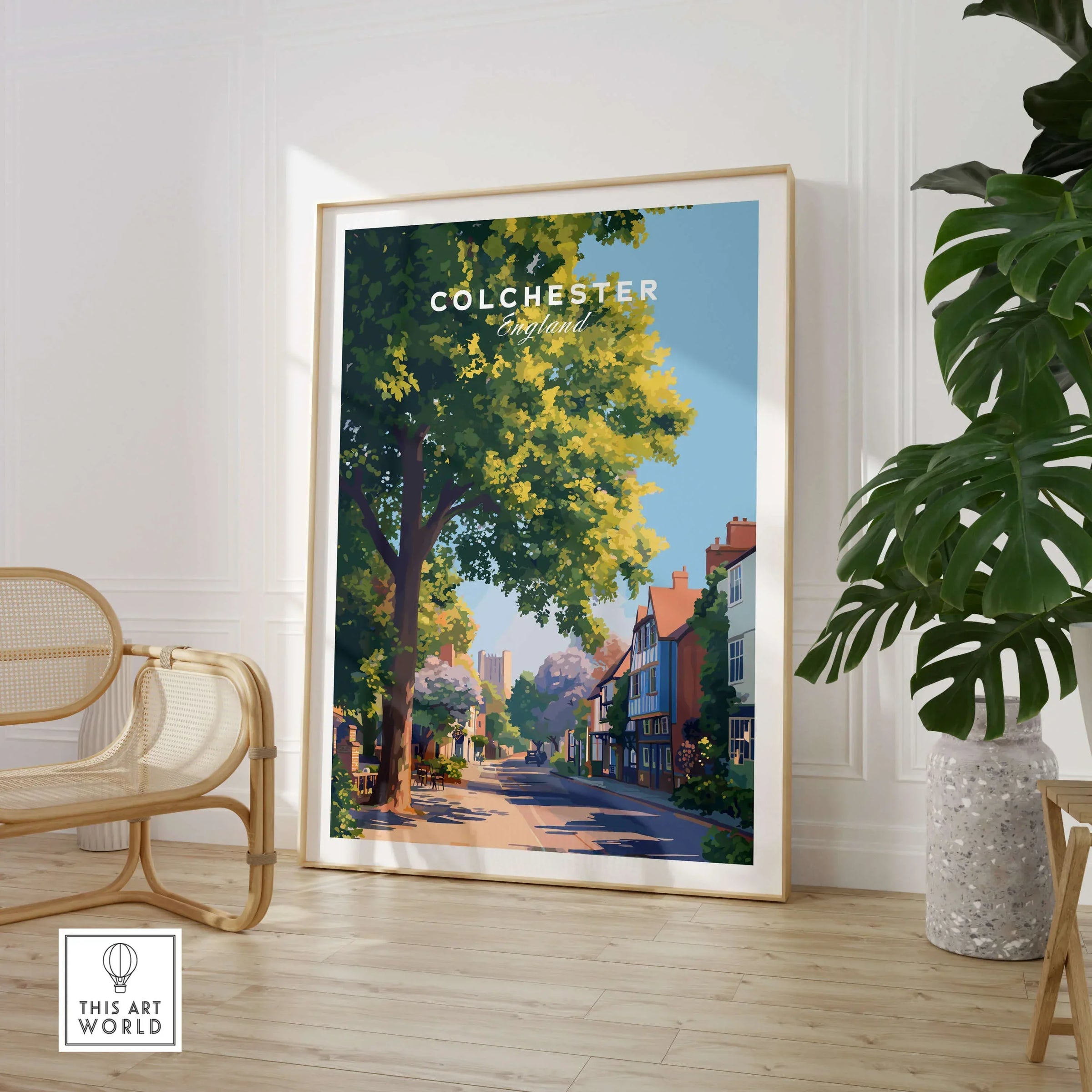 Colchester travel poster framed in modern room with chair and indoor plant