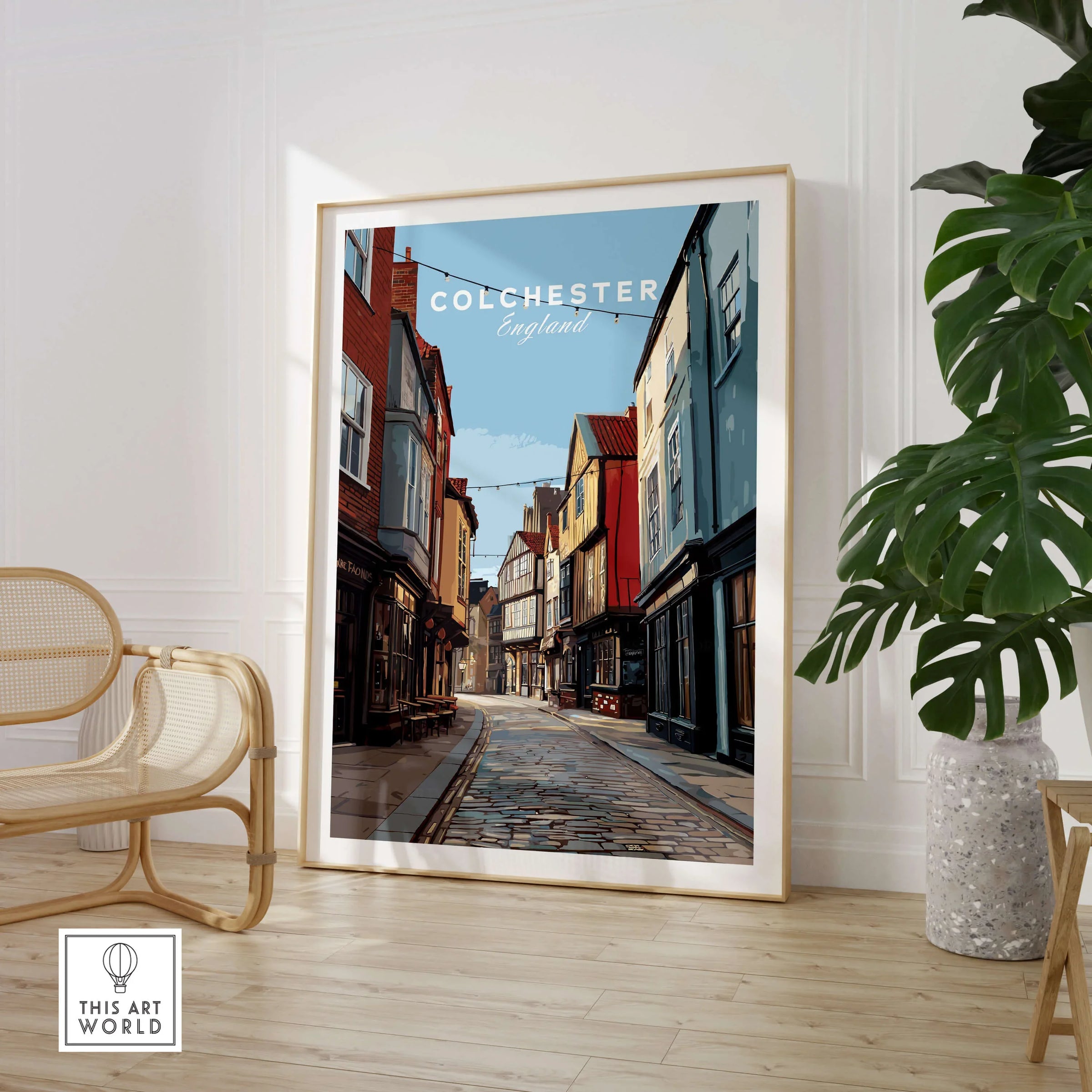 Colchester England travel poster framed print in modern room with chair and plant
