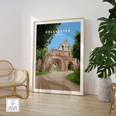 Colchester England travel poster in frame, modern room with chair and green plant