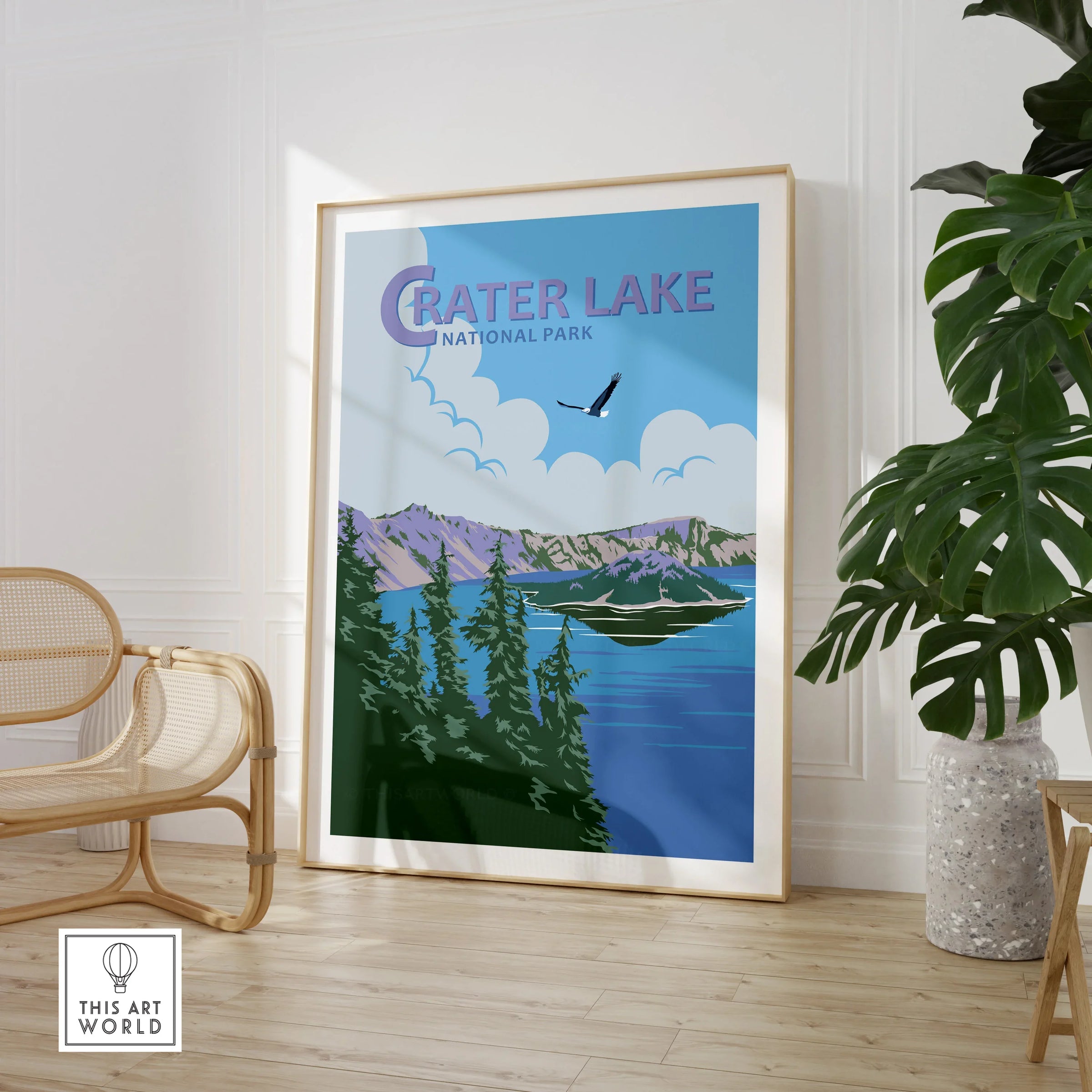 Framed Crater Lake National Park print in modern room with chair and plant