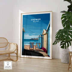 Cromer Travel Poster – Norfolk Beach Huts Art Print displayed in a stylish interior featuring colorful beach huts and seaside view.