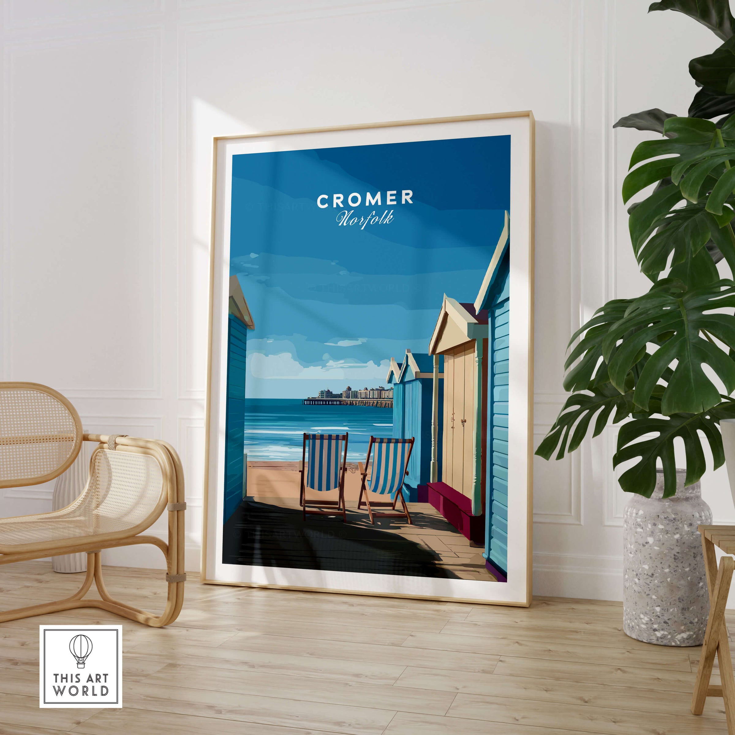 Cromer Travel Poster – Norfolk Beach Huts Art Print displayed in a stylish interior featuring colorful beach huts and seaside view.