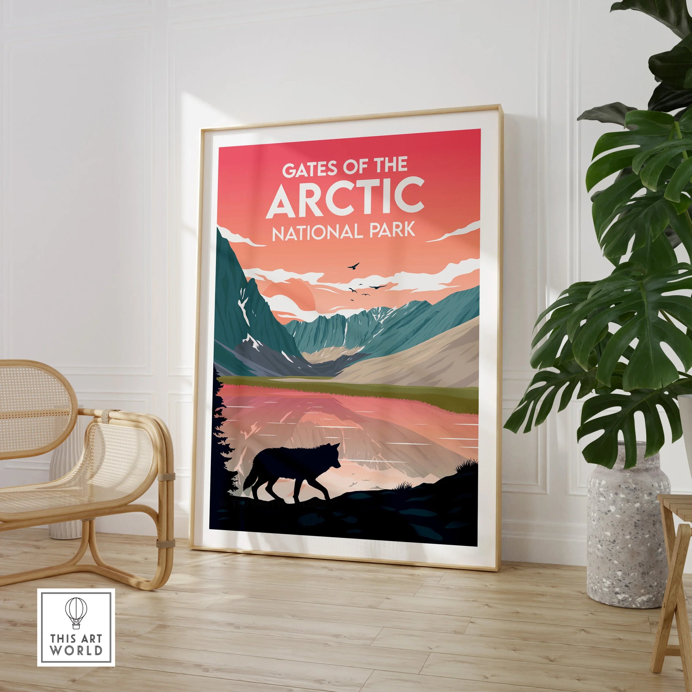 Framed Gates of the Arctic National Park print in modern room with chair and plant