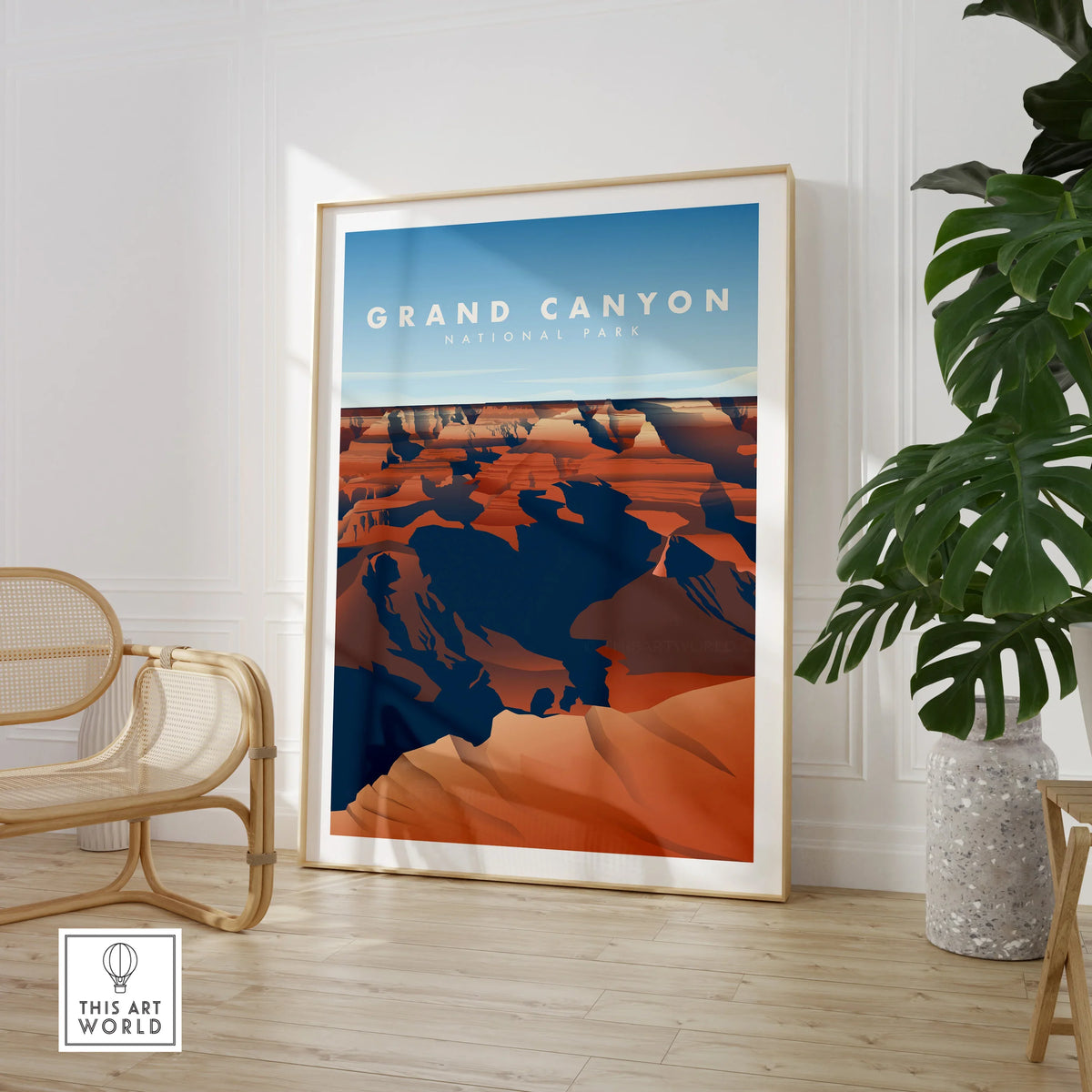 Framed Grand Canyon National Park art print in stylish room with chair and potted plant