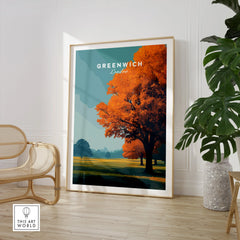 Framed Greenwich London travel poster with orange tree, styled in modern living room decor