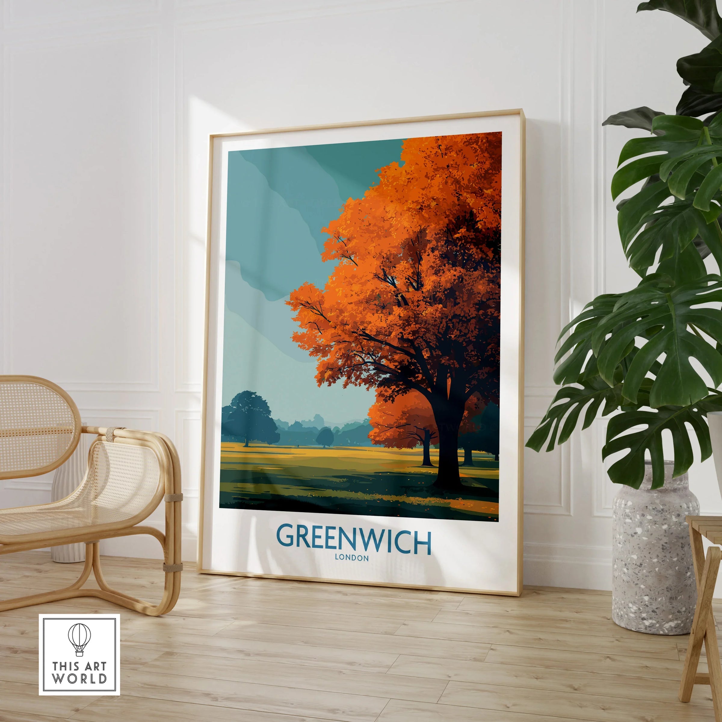 Framed Greenwich London travel poster with autumn tree, displayed in modern living room decor.