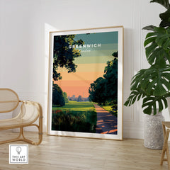 Framed Greenwich London travel poster print in modern living room with chair and plant