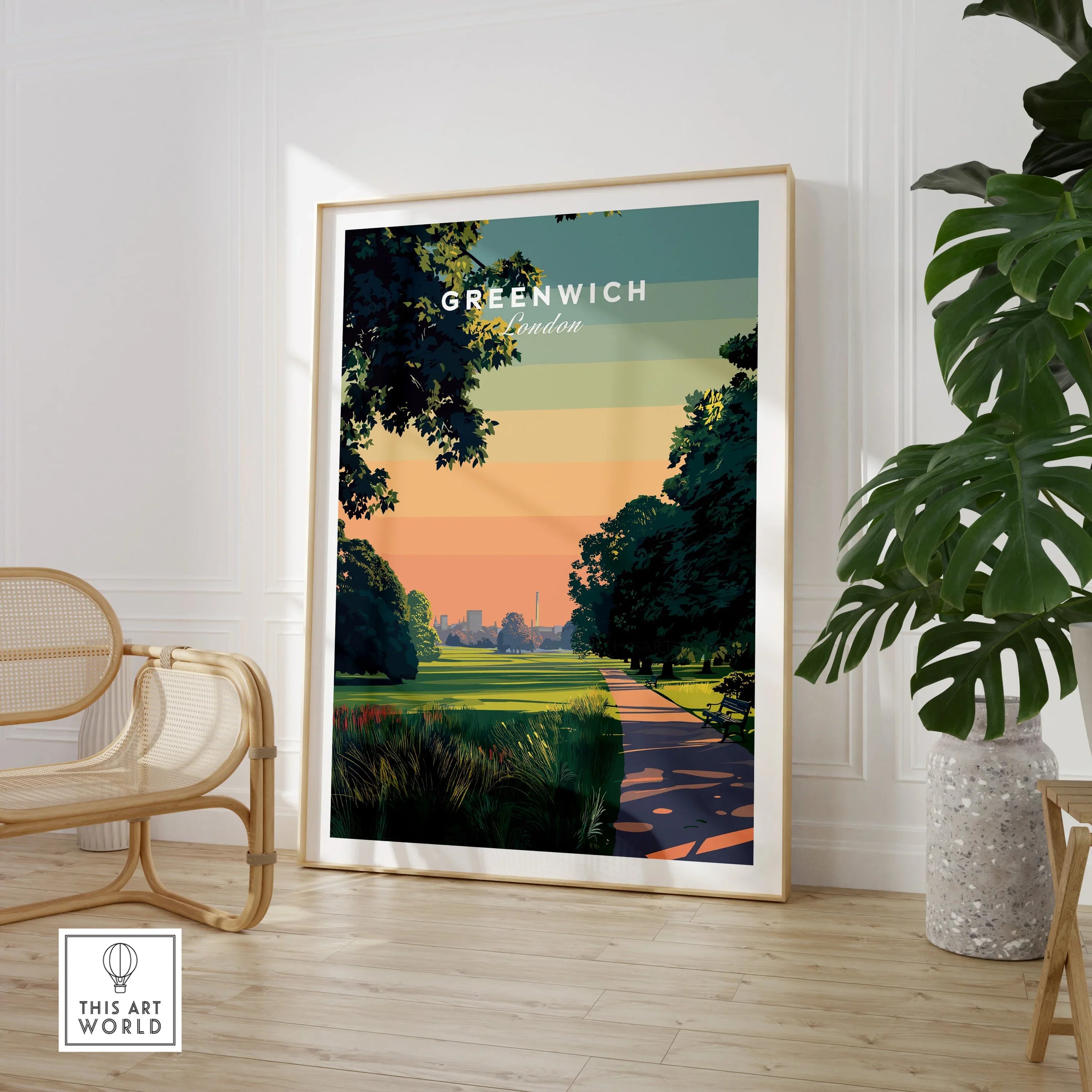 Framed Greenwich London travel poster print in modern living room with chair and plant