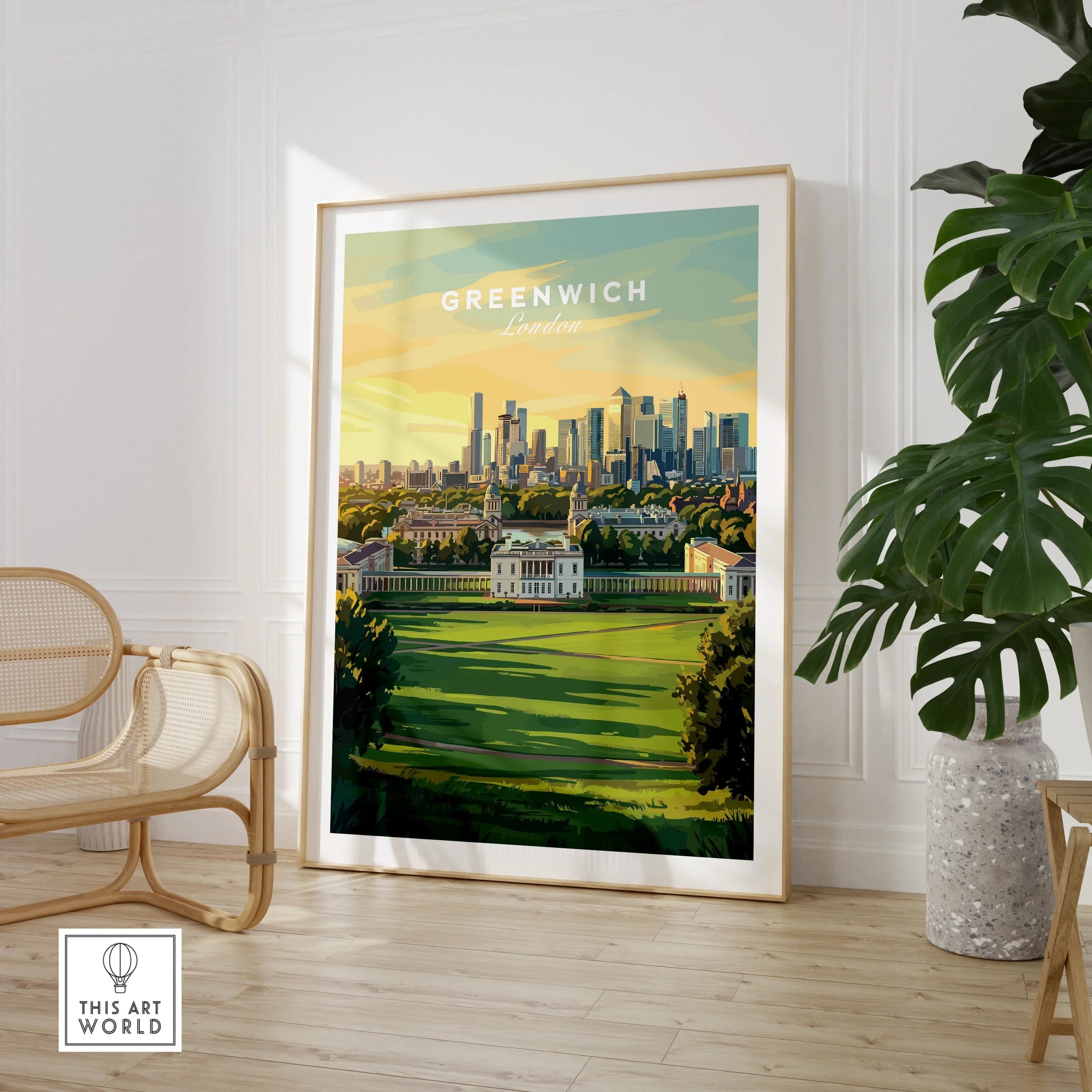 Framed Greenwich London travel poster print in modern living room with chair and plant.