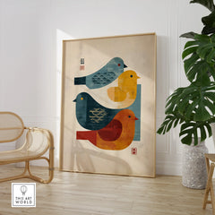 Framed Japanese bird art print in modern room with wooden chair and green plant