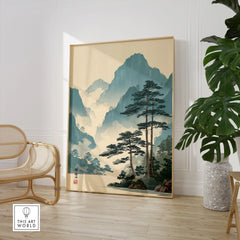 Framed Japanese woodblock landscape print in modern room with chair and indoor plant