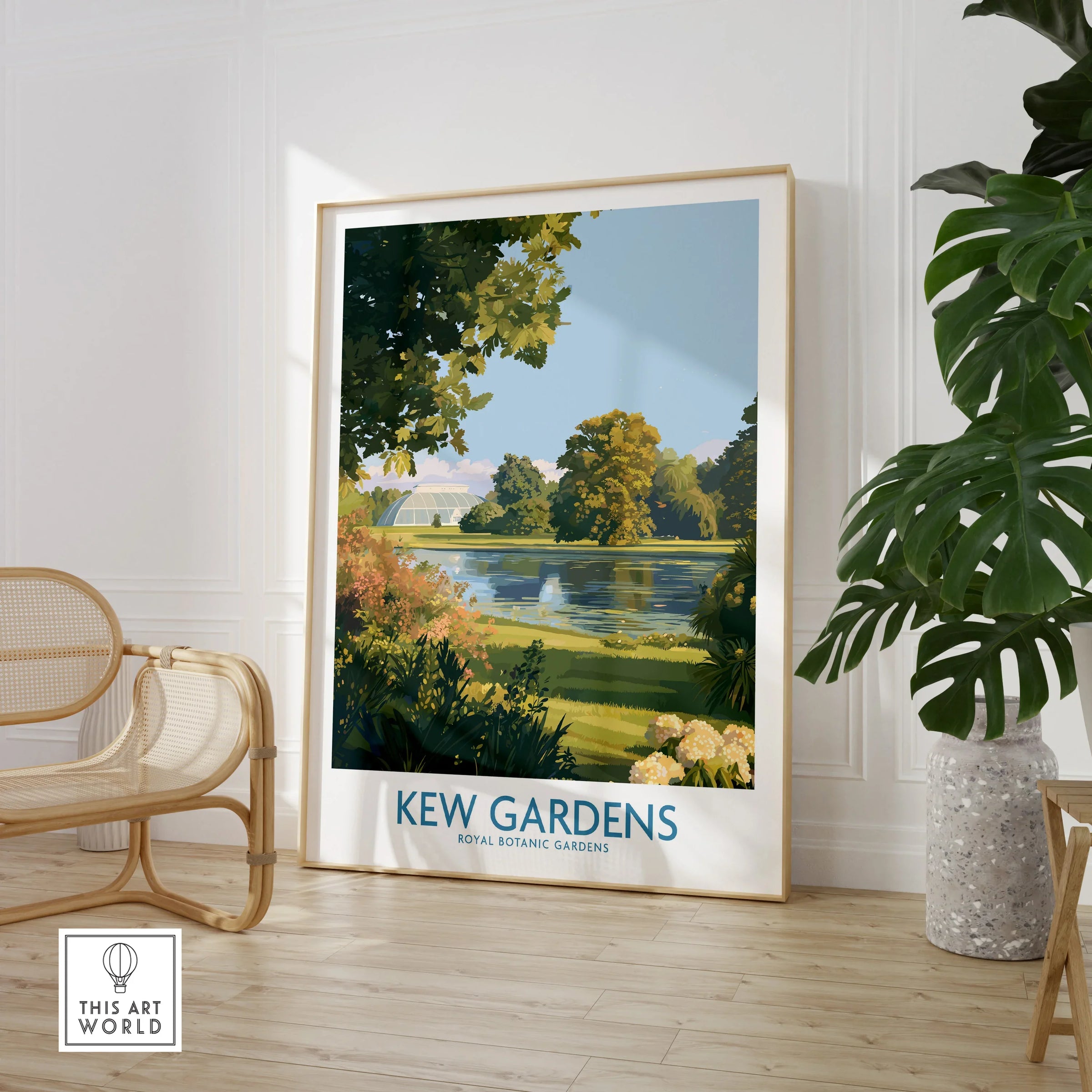 Framed Kew Gardens art print in modern room with cane chair and potted plant