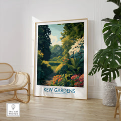 Framed Kew Gardens travel poster in stylish room with chair and large green plant