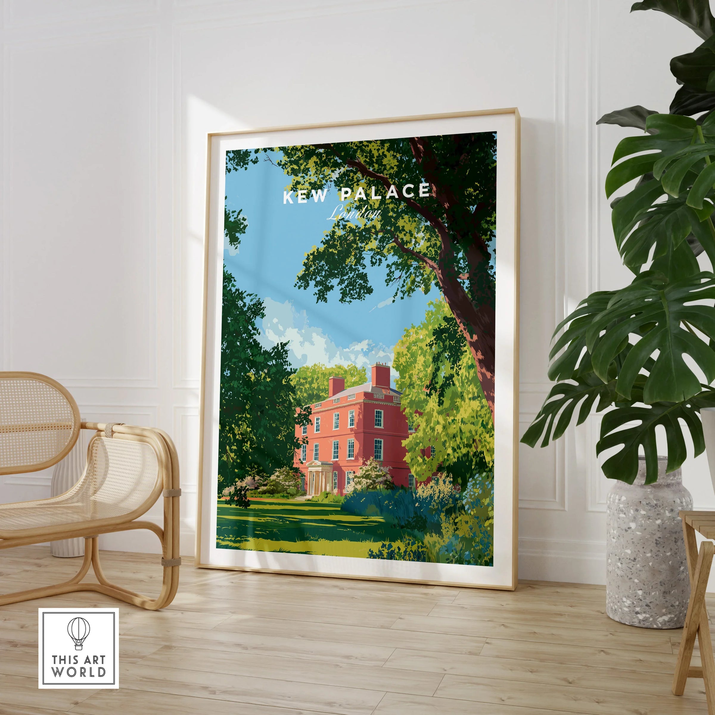 Framed Kew Palace travel poster print in stylish room with chair and potted plant