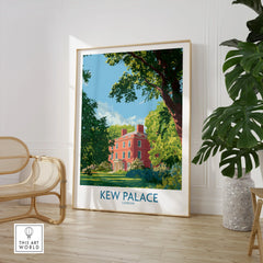 Framed Kew Palace London art print in a modern room with a chair and green plant