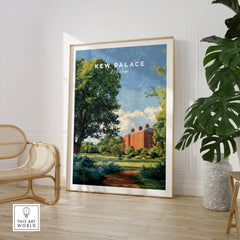Framed Kew Palace London travel poster in modern living room with chair and plant.