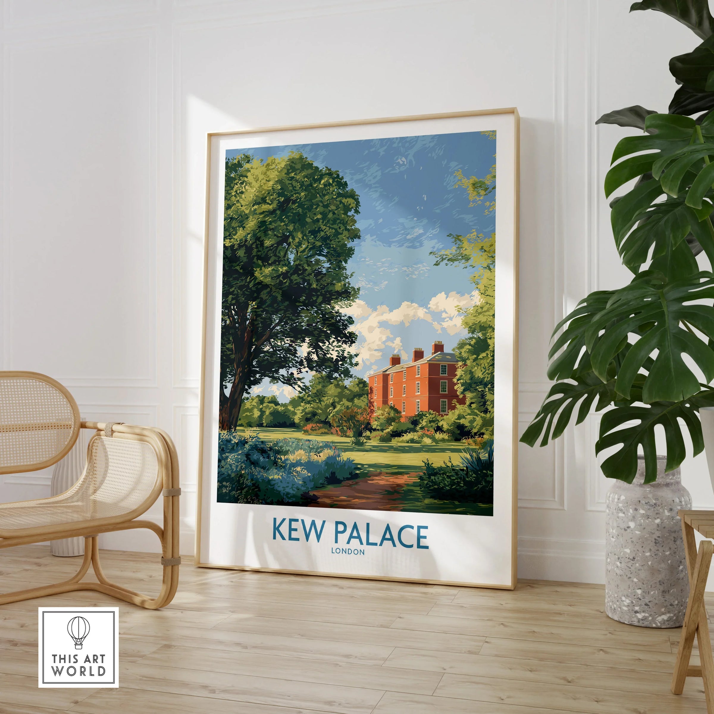 Framed Kew Palace London travel poster in modern room with chair and indoor plant