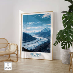 Kluane Poster National Park Canada | Snow Capped Mountains Canvas Print displayed in a cozy room with a plant.