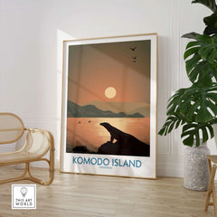 Framed Komodo Island travel poster with sunset, in modern room with chair and plant