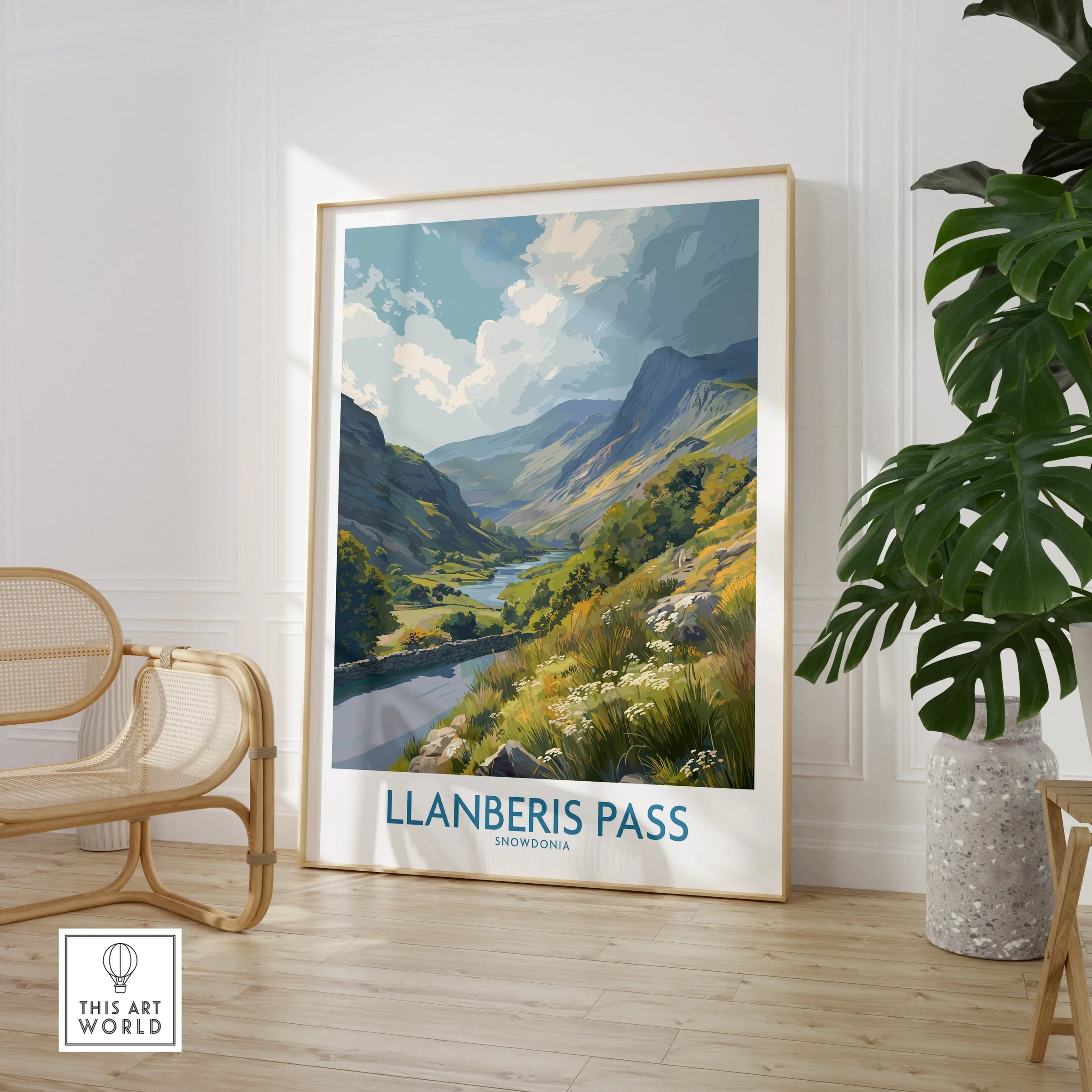 Llanberis Pass Snowdonia travel poster in a modern room with chair and plant