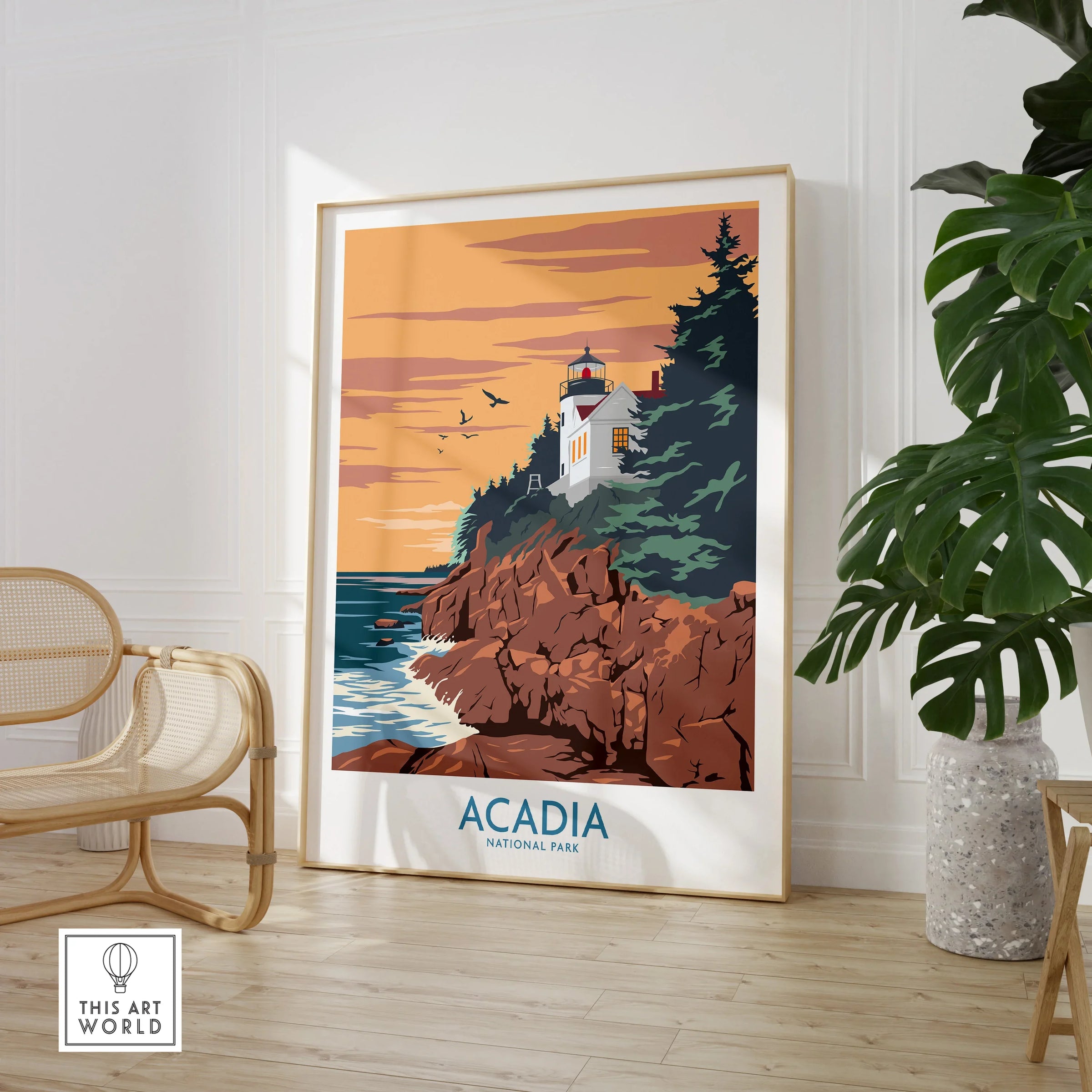 Framed Acadia National Park poster with lighthouse, rocky coast, and sunset in modern living room