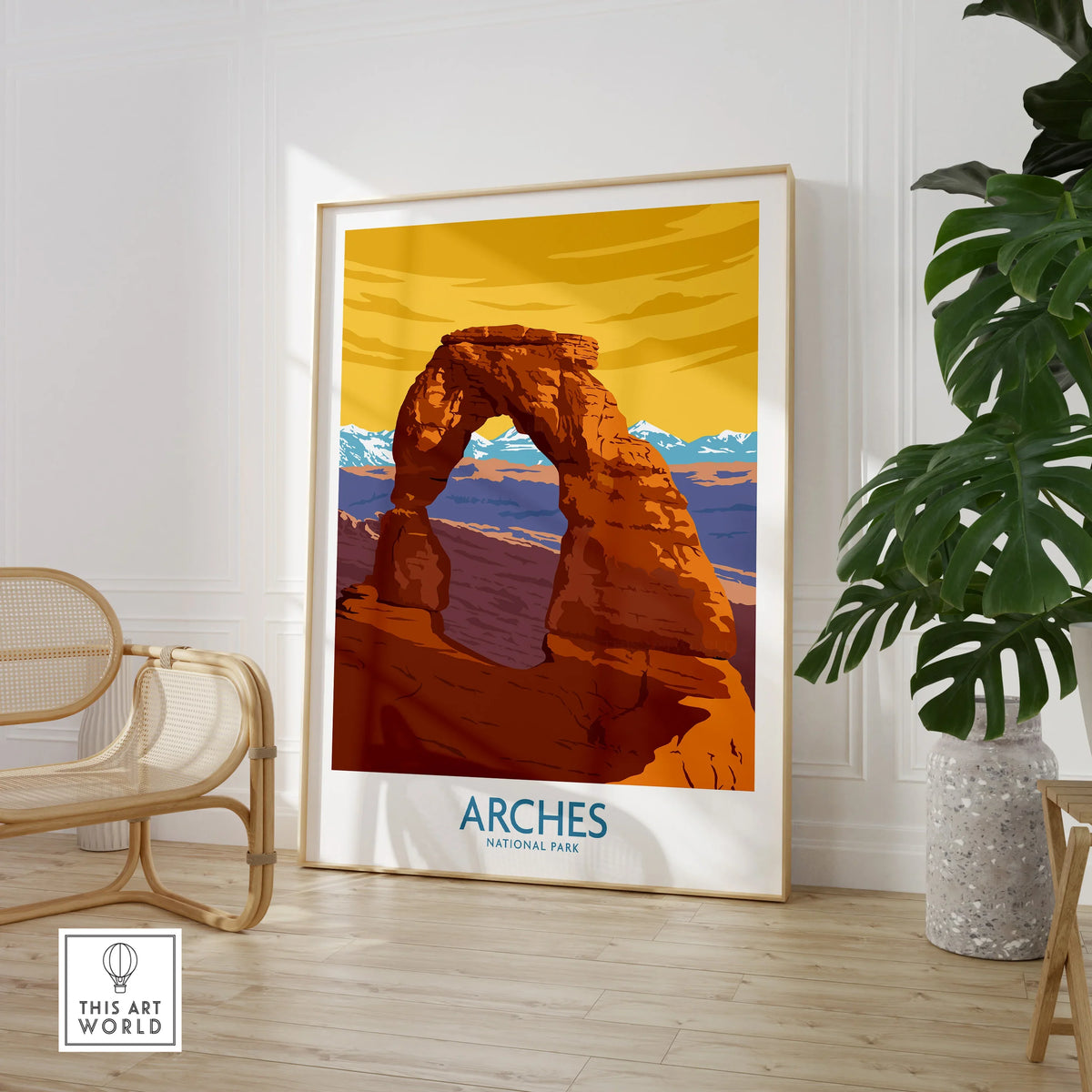 Framed Arches National Park travel poster in modern room with chair and plant