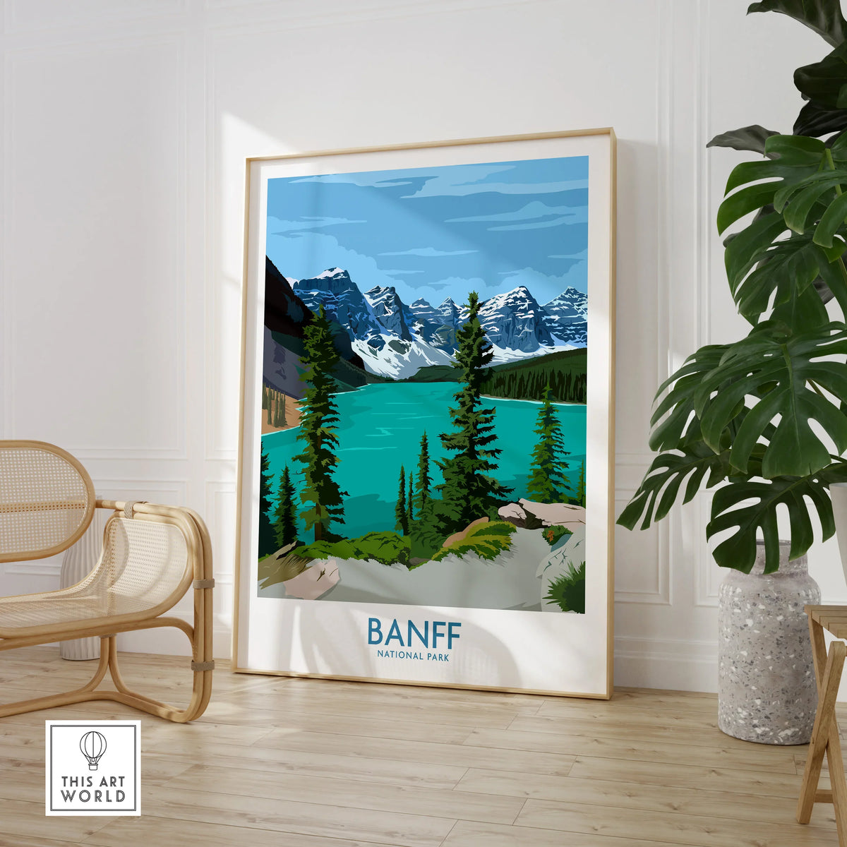 Banff National Park travel poster in a modern room with chair and potted plant