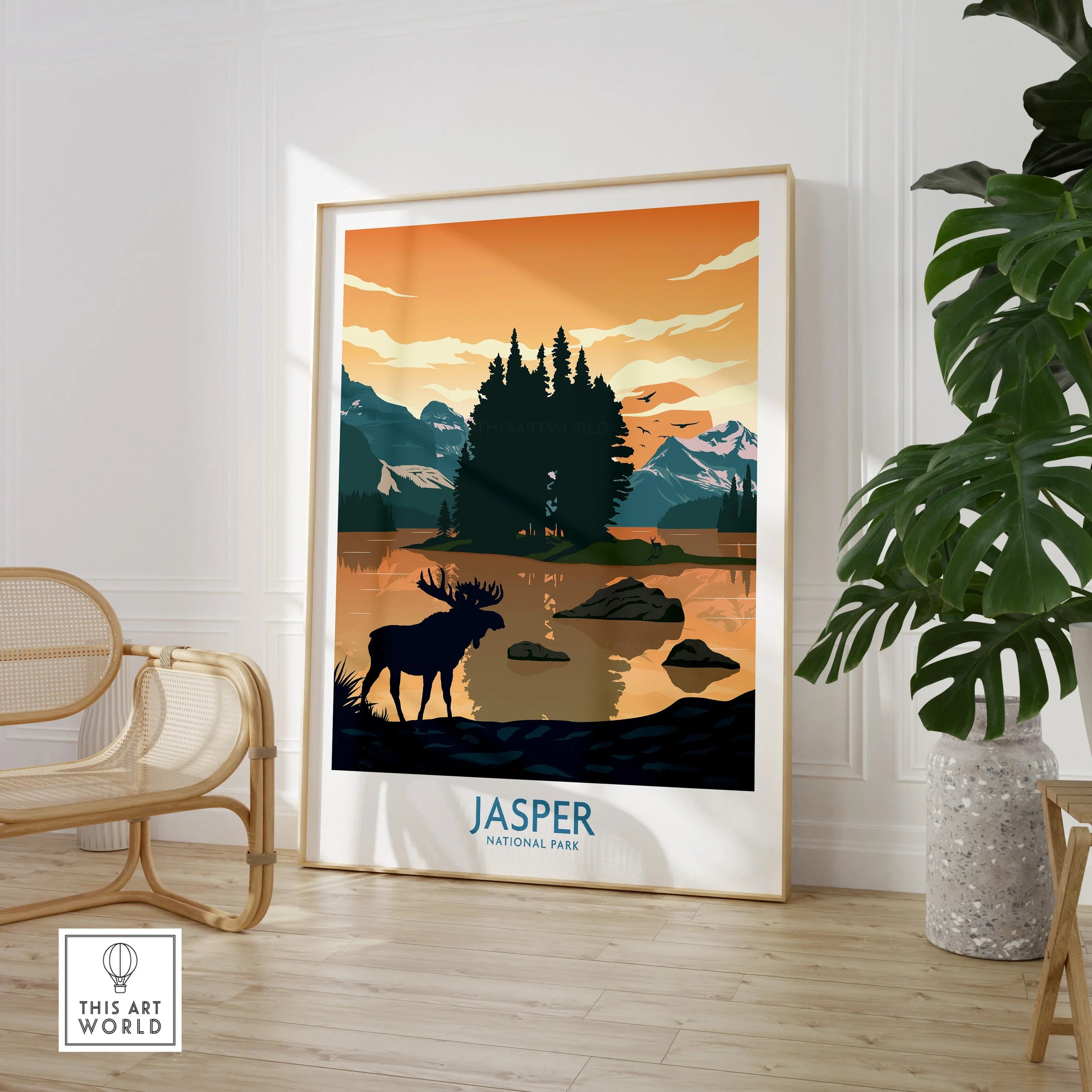 Framed Jasper National Park art print in modern room with chair and green plant