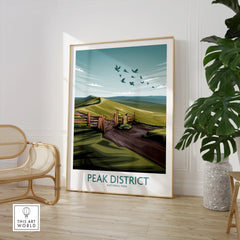 Peak District National Park framed travel poster in modern living room with chair and plant