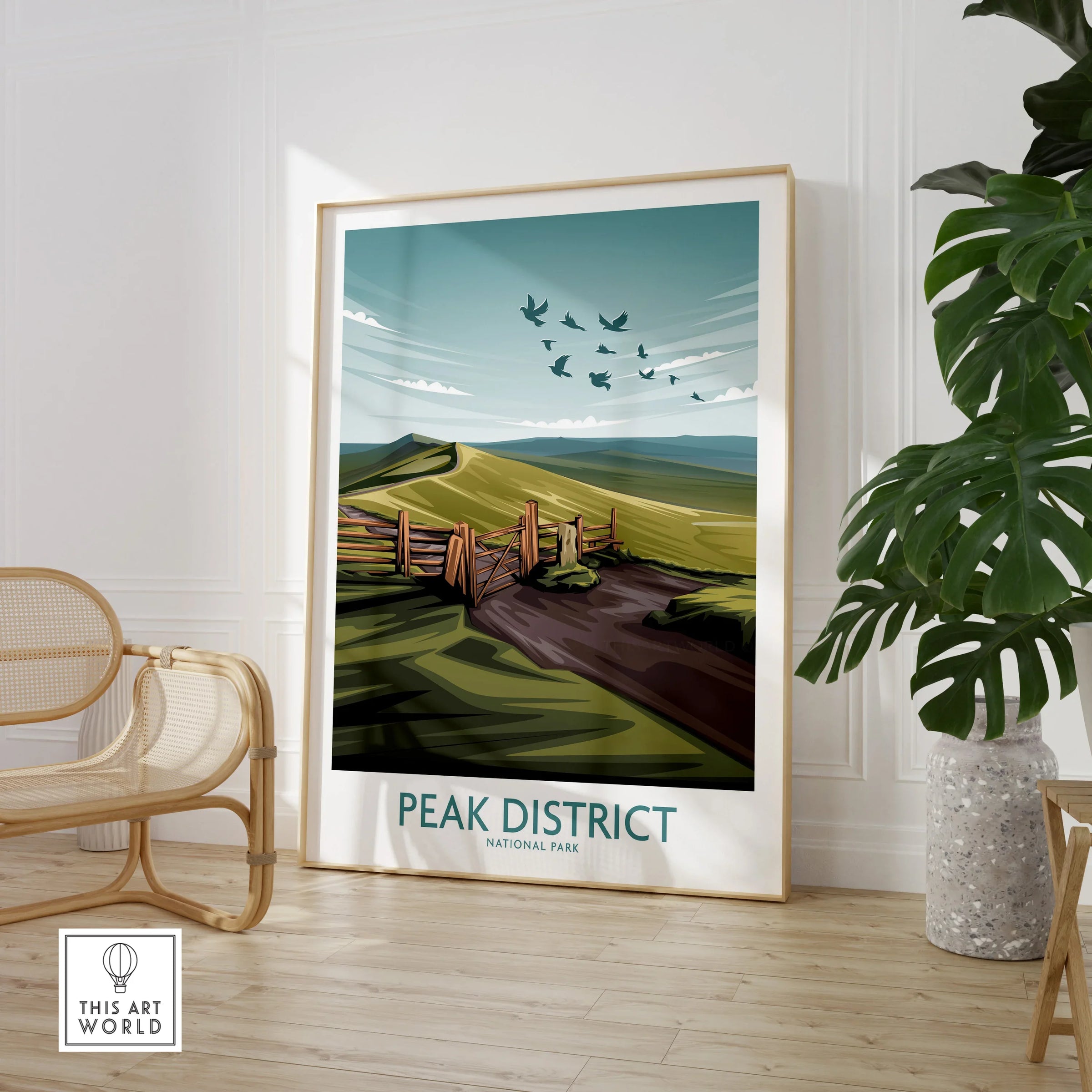 Peak District National Park framed travel poster in modern living room with chair and plant