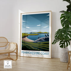 Framed Pembrokeshire Coast National Park travel poster in modern room with chair and plant