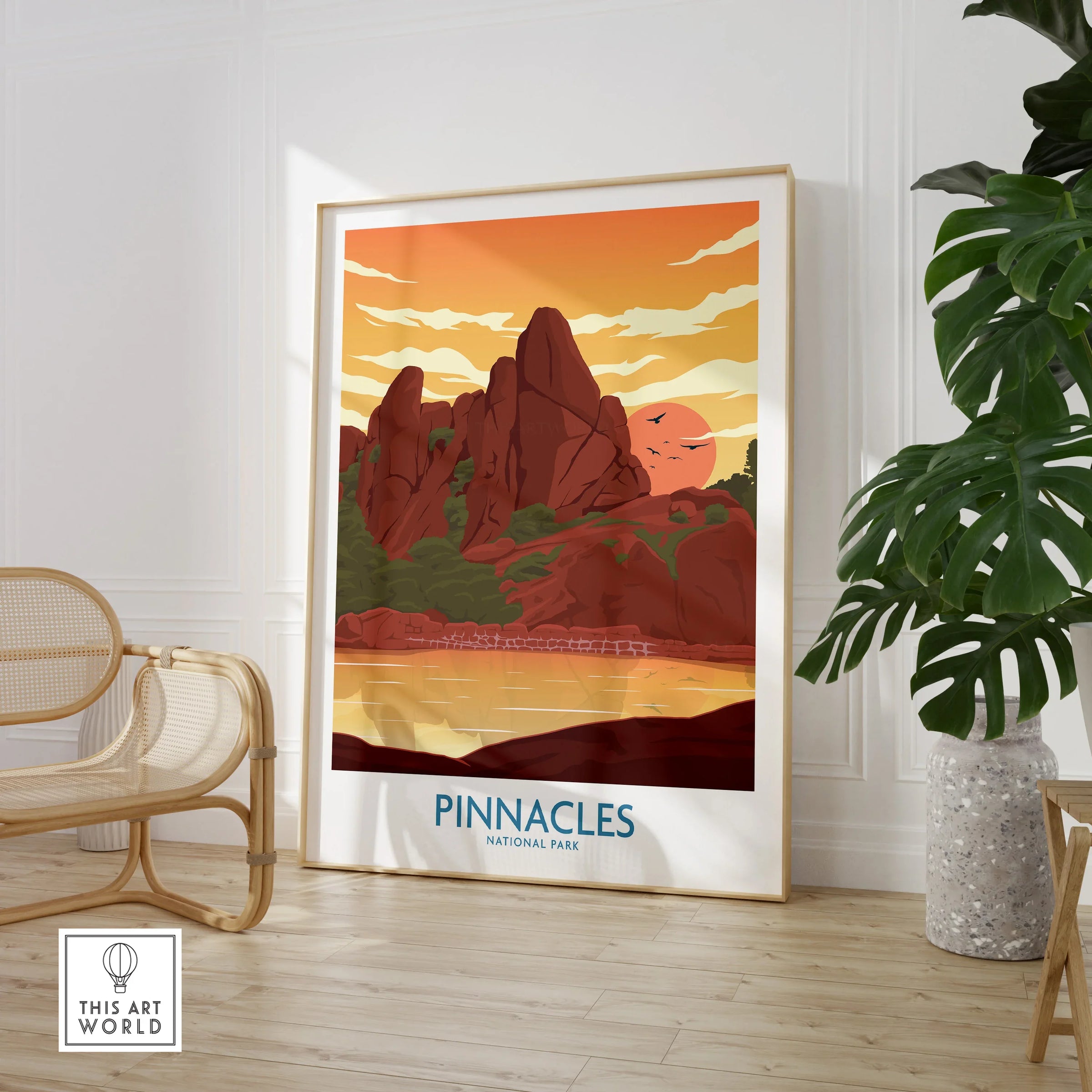 Pinnacles National Park framed travel poster in modern living room with chair and plant