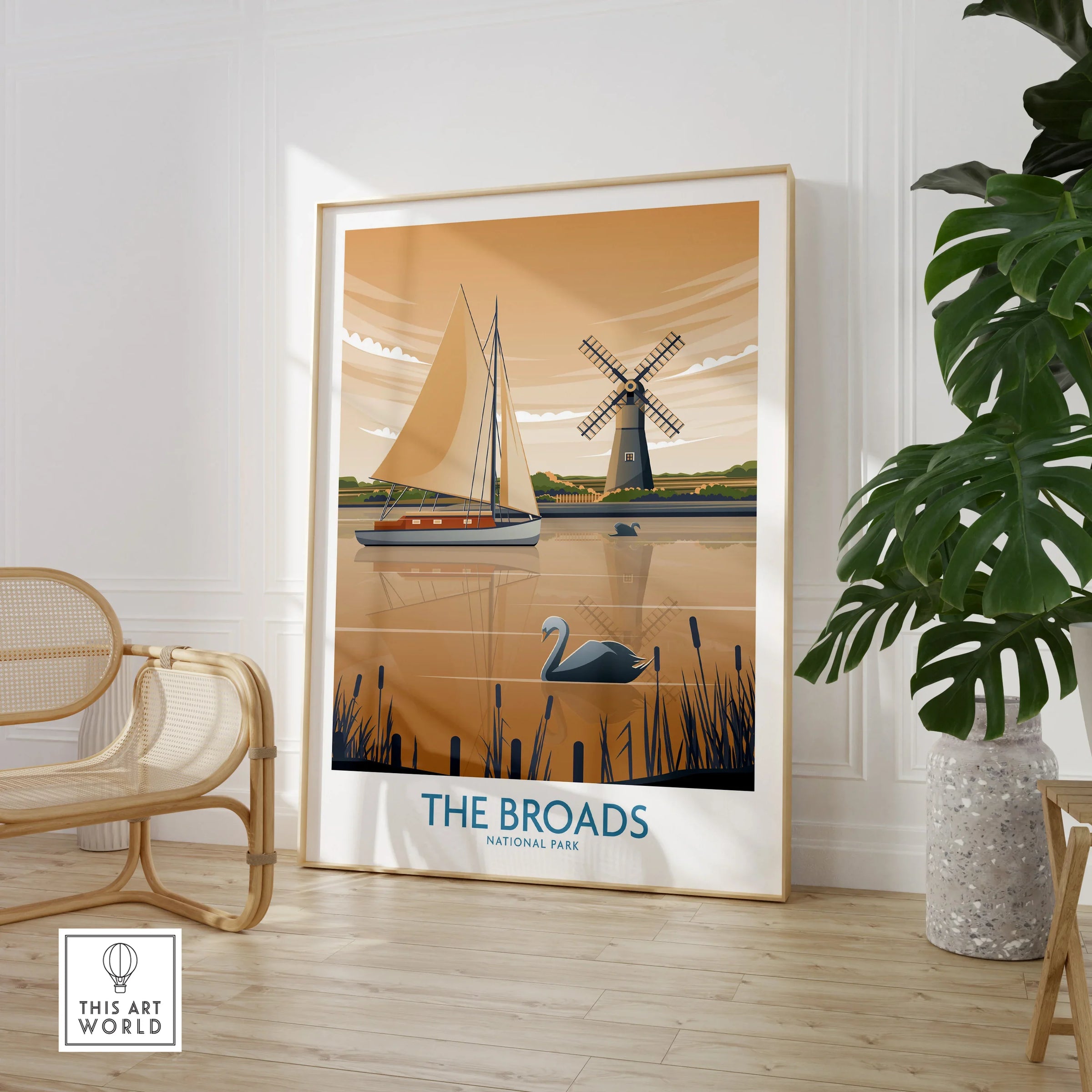 Framed The Broads National Park print with sailboat and windmill, styled in modern room