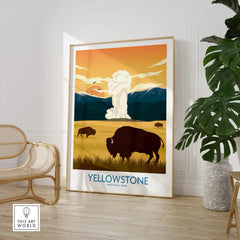 Yellowstone National Park print with bison and geyser, framed in modern room with chair and plant