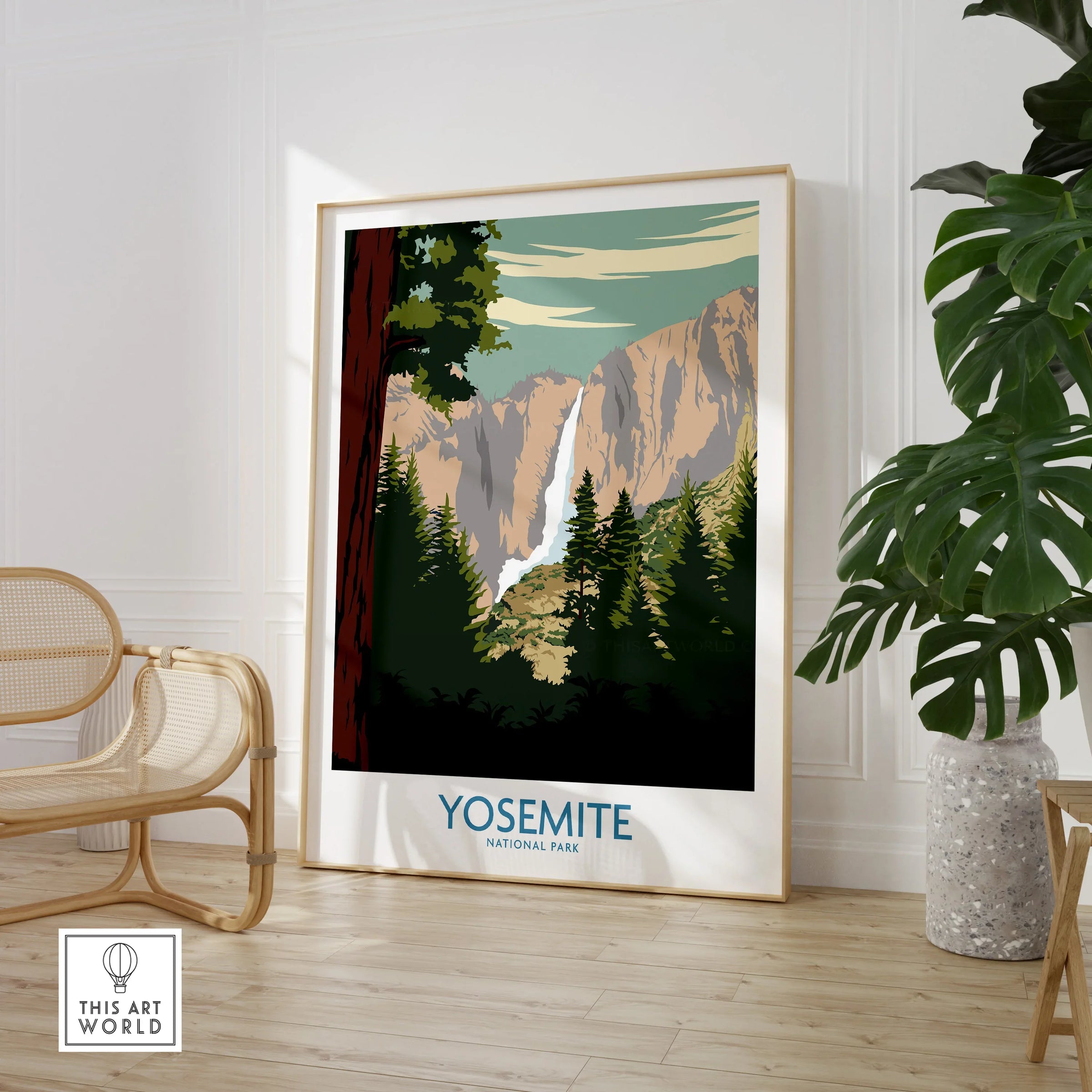 Framed Yosemite National Park travel poster in a modern room with chair and plant