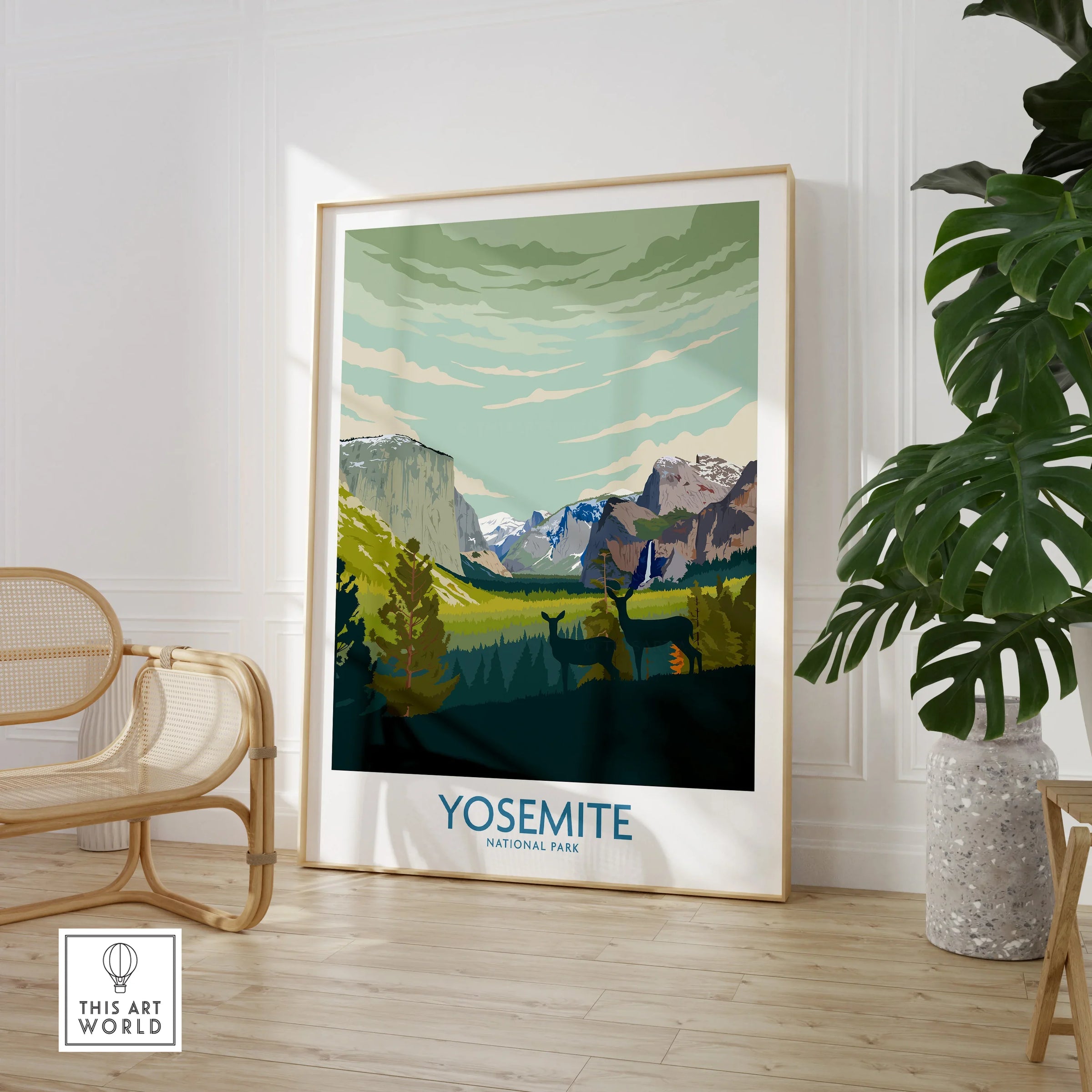 Yosemite National Park travel poster framed on floor in modern room with chair and plant